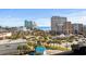 Bright sunny view of the city with palm trees, hotels, and attractions like a roller coaster and Ferris wheel, perfect for vacations at 601 Mitchell Dr. # 808, Myrtle Beach, SC 29577