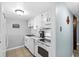 Bright kitchen features white cabinets, appliances, tile floors, and plenty of counter space at 601 Mitchell Dr. # 808, Myrtle Beach, SC 29577