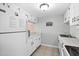 The kitchen is equipped with white cabinets and appliances, and a bright neutral color scheme at 601 Mitchell Dr. # 808, Myrtle Beach, SC 29577