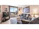 Comfortable living room with balcony access offering city and ocean views, complemented by stylish decor at 601 Mitchell Dr. # 808, Myrtle Beach, SC 29577