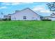Expansive backyard with lush green lawn, and well-maintained landscaping at 676 Lafayette Park Dr., Little River, SC 29566