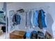 Organized walk-in closet with hanging clothes and shelving, providing ample storage space at 676 Lafayette Park Dr., Little River, SC 29566