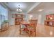 Spacious dining area featuring hardwood floors, a wooden dining set, and decorative hutch with natural light at 676 Lafayette Park Dr., Little River, SC 29566