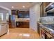 Modern kitchen with stainless steel appliances, stylish backsplash, dark wood cabinets, and hardwood flooring at 676 Lafayette Park Dr., Little River, SC 29566