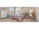 Sunlit bedroom featuring a white iron bed frame and ample natural light at 750 Plumage Ct., Myrtle Beach, SC 29588