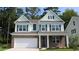 Charming two-story home boasts brick and siding exterior, attached garage, and manicured lawn at 750 Plumage Ct., Myrtle Beach, SC 29588