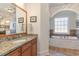 Bathroom with dual vanity, granite countertop, soaking tub, and tile flooring at 80 Stonington Dr., Murrells Inlet, SC 29576