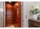 Interior elevator featuring wooden trim, carpeted floor, and controls at 80 Stonington Dr., Murrells Inlet, SC 29576