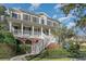 Beautiful home with a inviting front porch, manicured yard, and detailed brickwork at 80 Stonington Dr., Murrells Inlet, SC 29576