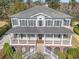 Aerial view showcases this two-story home's metal roof and expansive front porch at 80 Stonington Dr., Murrells Inlet, SC 29576