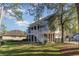 View of backyard featuring multi-level decks, a brick exterior, and a lush lawn at 80 Stonington Dr., Murrells Inlet, SC 29576