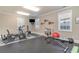 Well-equipped home gym with exercise machines, weights, and rubber flooring at 80 Stonington Dr., Murrells Inlet, SC 29576