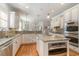 Spacious kitchen featuring granite countertops, stainless steel appliances, recessed lighting, and hardwood floors at 80 Stonington Dr., Murrells Inlet, SC 29576