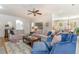 Bright living room features ample seating, a neutral color palette, and seamless flow to the dining area at 80 Stonington Dr., Murrells Inlet, SC 29576