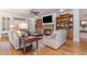 Spacious living room features built-in cabinets, fireplace, and hardwood floors for a comfortable setting at 80 Stonington Dr., Murrells Inlet, SC 29576