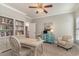 Bright office space with built-in bookshelves, desk, chair, and a colorful accent cabinet at 80 Stonington Dr., Murrells Inlet, SC 29576