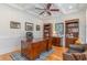 Well-appointed home office with custom built-ins, tray ceiling, and ample natural light at 80 Stonington Dr., Murrells Inlet, SC 29576