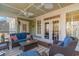 Inviting porch with comfortable seating, decorative pillows, and outdoor furniture at 80 Stonington Dr., Murrells Inlet, SC 29576
