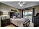 This bedroom features a ceiling fan and a sliding glass door with access to a balcony at 806 Conway St. # 309, North Myrtle Beach, SC 29582