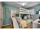 A bedroom features a bunk bed with a slide, carpet, and a ceiling fan at 806 Conway St. # 309, North Myrtle Beach, SC 29582