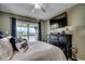 This bedroom has a large TV and a sliding glass door with access to a balcony at 806 Conway St. # 309, North Myrtle Beach, SC 29582