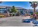 View of the condo complex featuring well-maintained landscaping, gate and building exterior at 806 Conway St. # 309, North Myrtle Beach, SC 29582