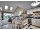 Bright kitchen with white cabinetry, an island, and views to living space at 806 Conway St. # 309, North Myrtle Beach, SC 29582
