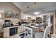 Bright kitchen with white cabinetry, stainless steel appliances, and prep island with seating at 806 Conway St. # 309, North Myrtle Beach, SC 29582