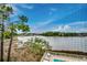 Overlooking a lake with a pool and lounge chairs in a neighborhood in the distance at 806 Conway St. # 309, North Myrtle Beach, SC 29582