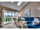 Comfortable living room filled with natural light, view to outdoor deck, and stylish coastal decor at 806 Conway St. # 309, North Myrtle Beach, SC 29582