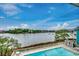 Beautiful outdoor pool overlooking a scenic waterway with lush vegetation and clear blue skies at 806 Conway St. # 309, North Myrtle Beach, SC 29582