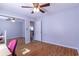 Bedroom with ceiling fan, closet, and wood-look flooring at 8091 Bark Ct., Murrells Inlet, SC 29576