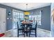 Cozy dining area with a round table and stylish pendant lighting at 8091 Bark Ct., Murrells Inlet, SC 29576