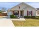 Charming single-story home with a well-manicured lawn and inviting front porch at 8091 Bark Ct., Murrells Inlet, SC 29576