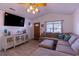 Comfortable living room features a plush sectional sofa and entertainment center at 8091 Bark Ct., Murrells Inlet, SC 29576