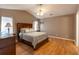 Primary bedroom with vaulted ceilings, a ceiling fan, and wood-look flooring at 8091 Bark Ct., Murrells Inlet, SC 29576