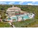 Aerial view showcases community pool, lush landscaping, and oceanfront access at 8285 Leone Circle, Myrtle Beach, SC 29579