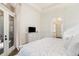 Bright primary bedroom with hardwood floors, ensuite, and neutral paint at 8285 Leone Circle, Myrtle Beach, SC 29579