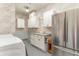 Laundry room featuring built-in cabinets, granite counters, neutral paint, and stainless steel refrigerator at 8285 Leone Circle, Myrtle Beach, SC 29579