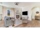 Inviting living room with a marble fireplace, decorative ceiling, and hardwood flooring at 8285 Leone Circle, Myrtle Beach, SC 29579