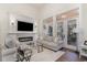 Bright living room with a fireplace, comfortable seating, and views to the outside at 8285 Leone Circle, Myrtle Beach, SC 29579
