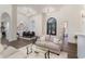 Open-concept living room adjacent to the kitchen and dining areas with archways, tile floors, and neutral colors at 8285 Leone Circle, Myrtle Beach, SC 29579