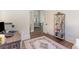 Bright office space with a decorative rug, bookshelf, and an open doorway to the living room at 8285 Leone Circle, Myrtle Beach, SC 29579