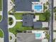 This aerial shot highlights the home's neatly landscaped yard, curved driveway, and proximity to a private swimming pool at 853 Bluffview Dr., Myrtle Beach, SC 29579