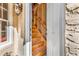 Interior shot of a wooden staircase inside a home, as seen from the entry at 876 Antiqua Dr., Myrtle Beach, SC 29572