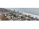 Aerial view displays the property's beachfront location and proximity to neighborhood homes, highlighting coastal community living at 900 N Waccamaw Dr. # 303, Murrells Inlet, SC 29576