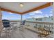 Relaxing balcony with comfortable seating, offering stunning ocean views and a perfect spot for enjoying sunsets at 900 N Waccamaw Dr. # 303, Murrells Inlet, SC 29576