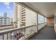 Balcony view of the exterior, with covered parking and ocean view highlighting the building's desirable coastal location at 900 N Waccamaw Dr. # 303, Murrells Inlet, SC 29576