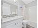 Bathroom featuring a marble countertop, faucet, decorative shower curtain, white cabinets, and a toilet at 900 N Waccamaw Dr. # 303, Murrells Inlet, SC 29576
