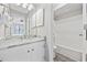 Well-lit bathroom featuring a large vanity, bright finishes, and a shower-tub combination, creating a relaxing space at 900 N Waccamaw Dr. # 303, Murrells Inlet, SC 29576